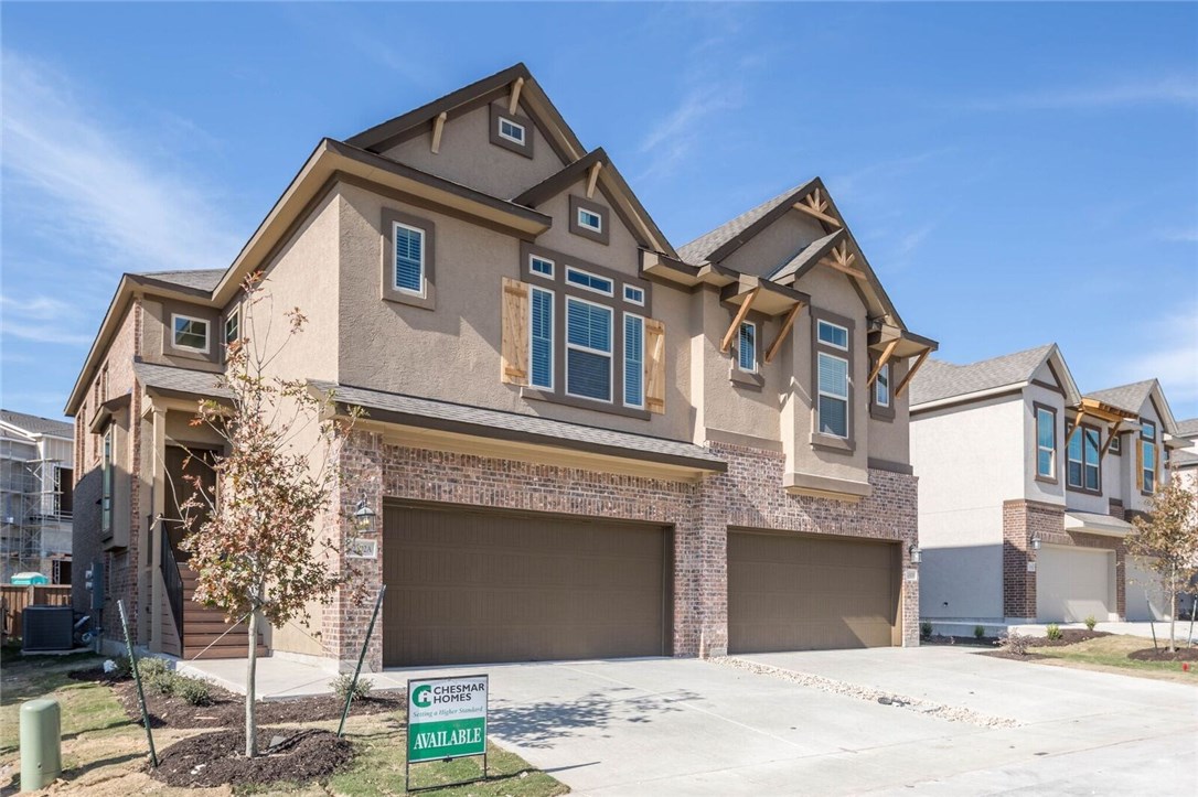 2302 Dillon Pond Lane, Unit A Pflugerville, TX 78660 - Photo 1 of 1 a front view of a house with a yard