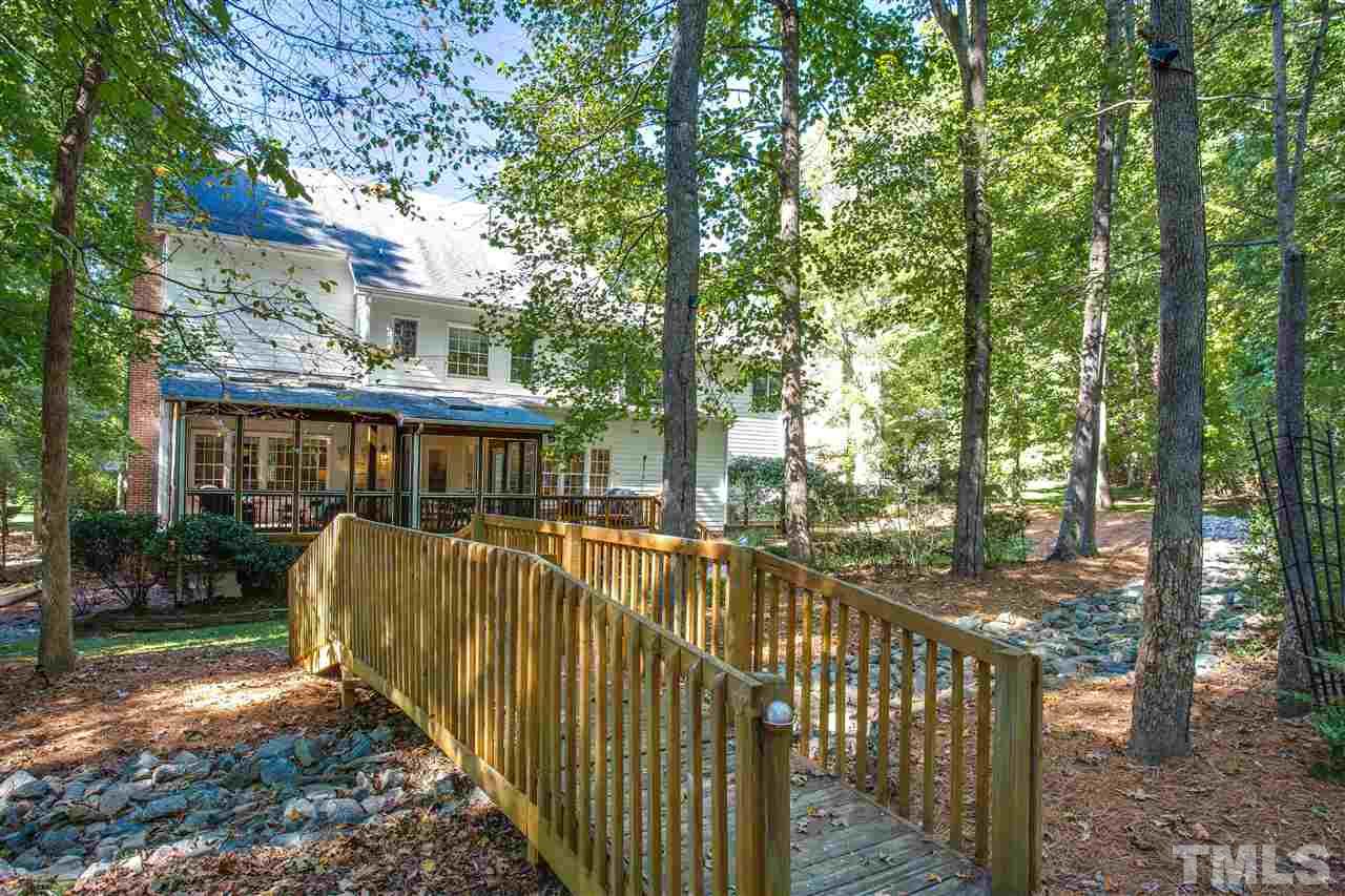9401 Gabe Court Raleigh, NC 27613 - Photo 22 of 25 Bridge in the back makes this feel like your own private park!