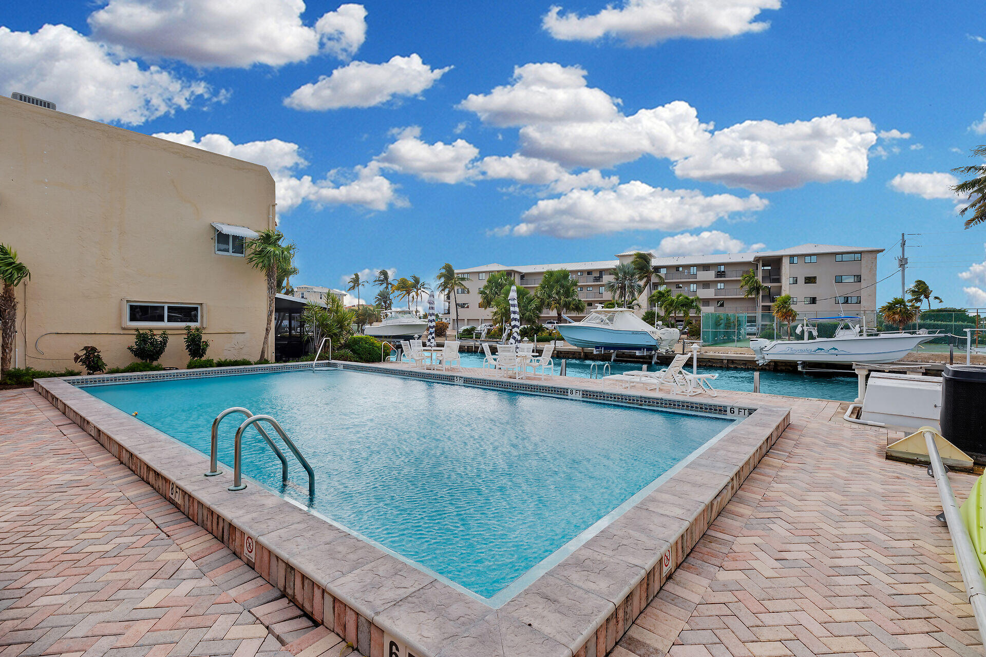 423 Sombrero Beach Road, Unit 9 Marathon, FL 33050 - Photo 29 of 42 Community Pool with Canal in Background