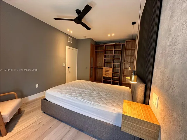 a bedroom with a bed and a couch