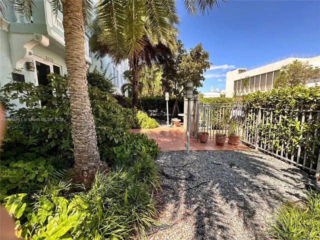 a view of a garden with a building