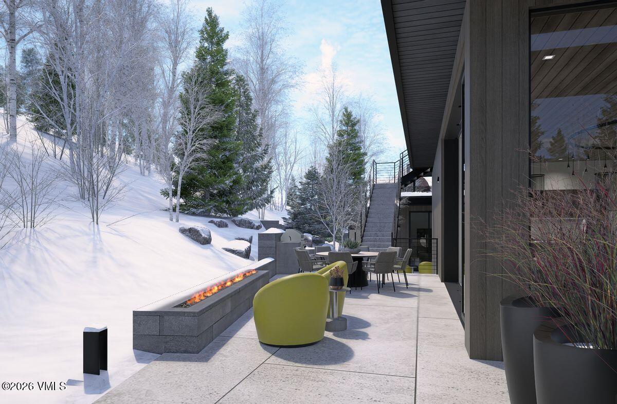 296 Rockledge Road Vail, CO 81657 - Photo 17 of 63 a view of a patio with couches and table and chairs with outdoor seating