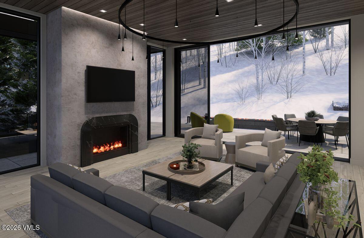296 Rockledge Road Vail, CO 81657 - Photo 2 of 63 a living room with furniture and a fireplace