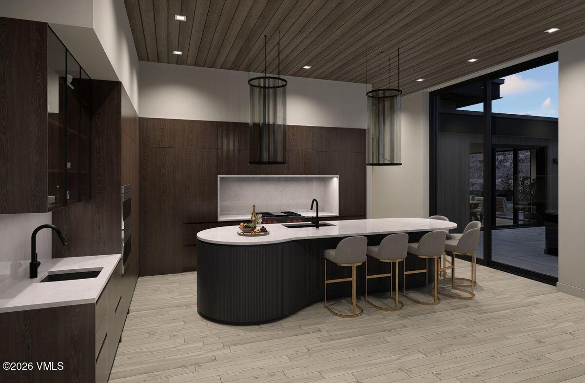 296 Rockledge Road Vail, CO 81657 - Photo 22 of 63 a kitchen with a sink stainless steel appliances and cabinets