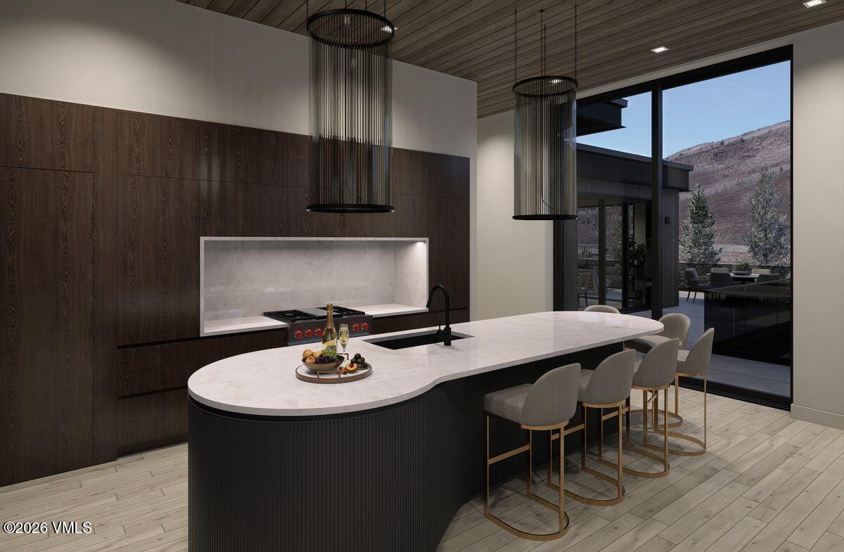 296 Rockledge Road Vail, CO 81657 - Photo 23 of 63 a kitchen with a sink cabinets and wooden floor