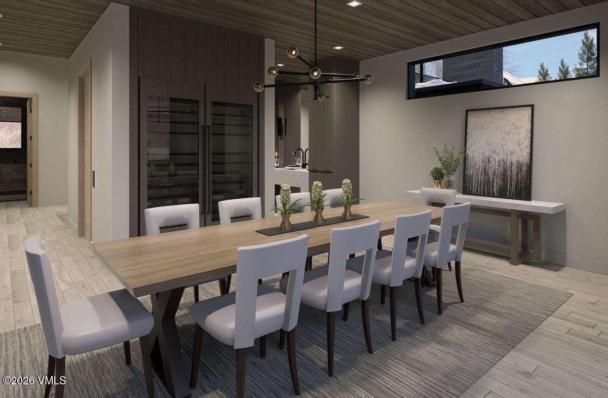 296 Rockledge Road Vail, CO 81657 - Photo 29 of 63 a dining room with furniture window and wooden floor