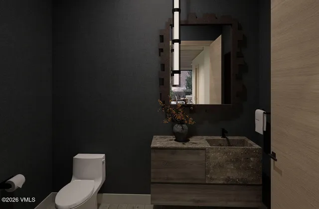 a bathroom with a double vanity sink mirror and bathtub