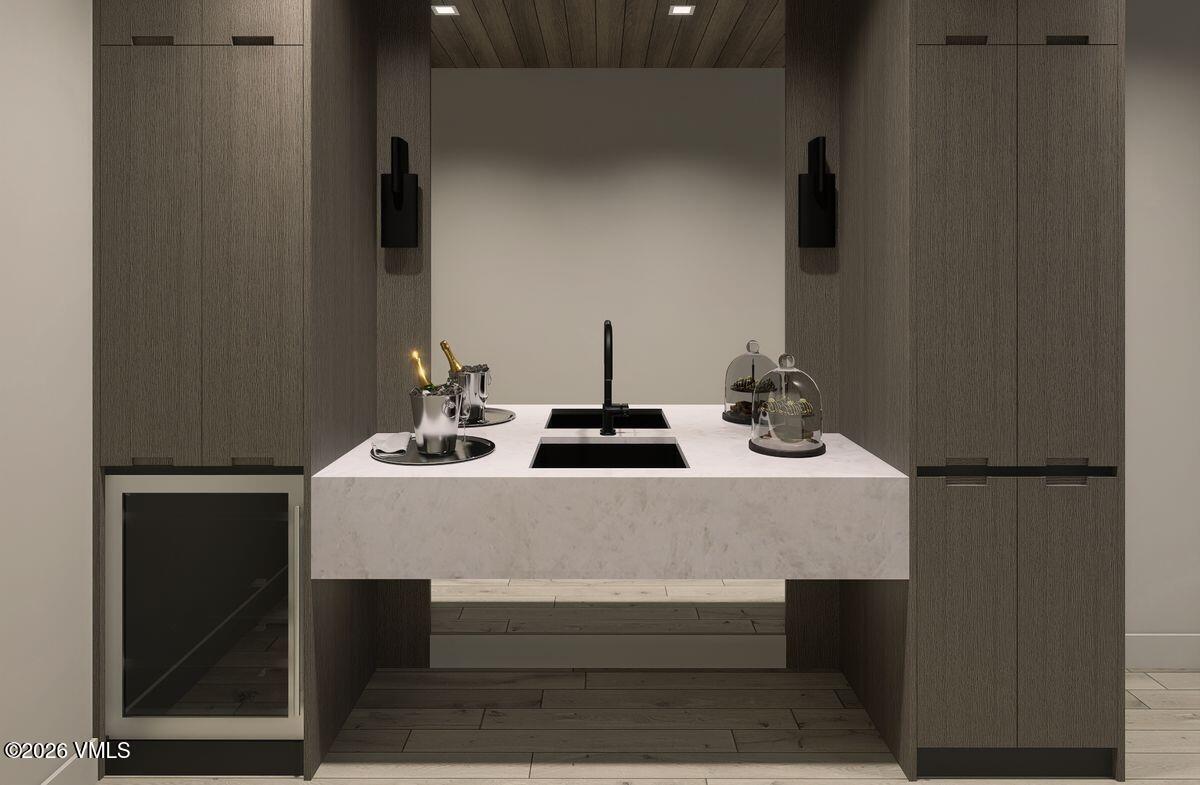 296 Rockledge Road Vail, CO 81657 - Photo 30 of 63 a table with a stove and a refrigerator