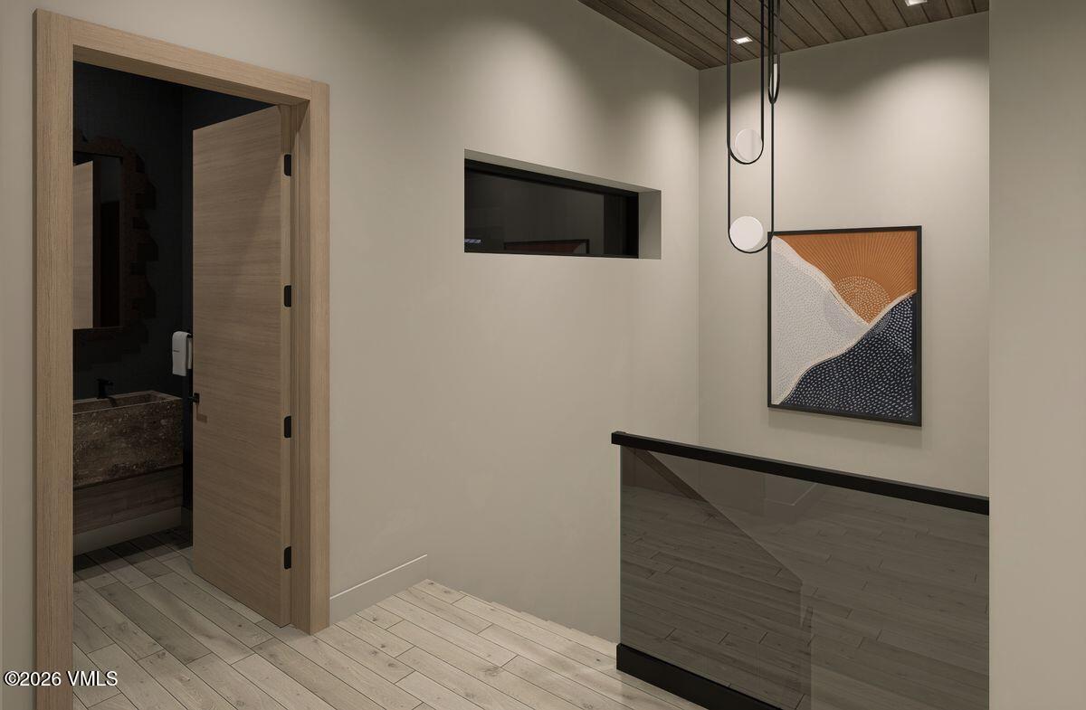 296 Rockledge Road Vail, CO 81657 - Photo 33 of 63 a view of a hallway with wooden floor