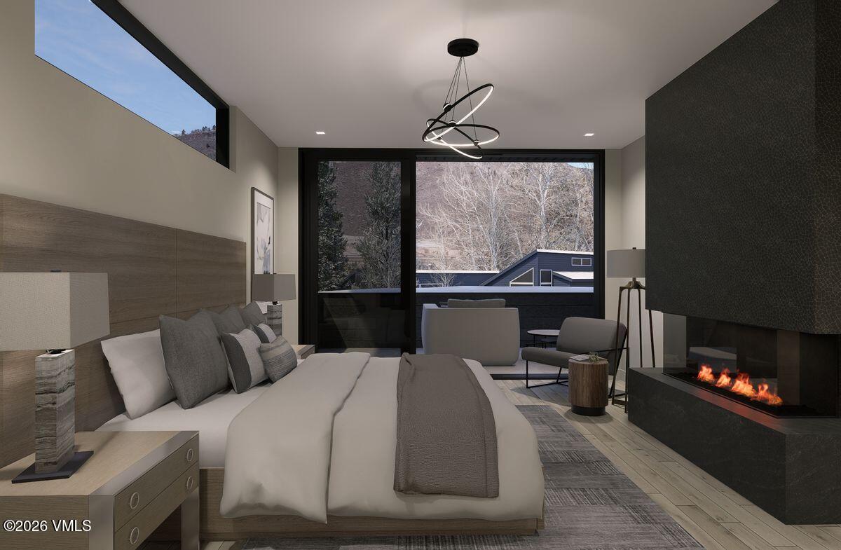 296 Rockledge Road Vail, CO 81657 - Photo 34 of 63 a bedroom with a bed and a fireplace