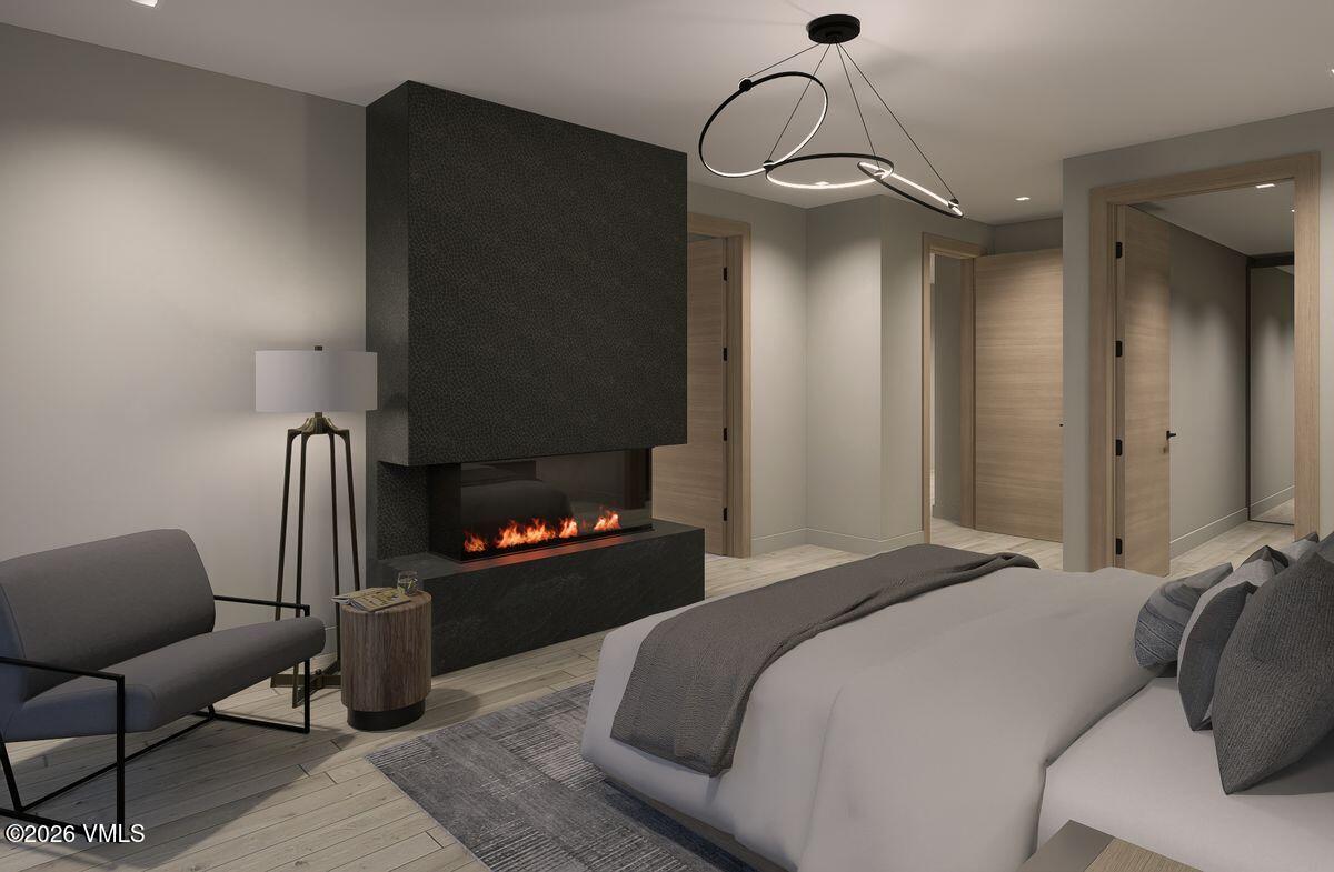 296 Rockledge Road Vail, CO 81657 - Photo 37 of 63 a bedroom with a bed and a chandelier