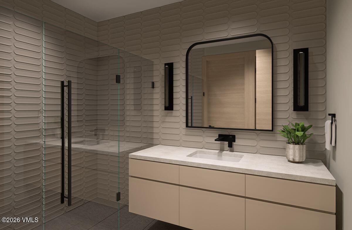 296 Rockledge Road Vail, CO 81657 - Photo 42 of 63 a bathroom with a sink a potted plant and mirror