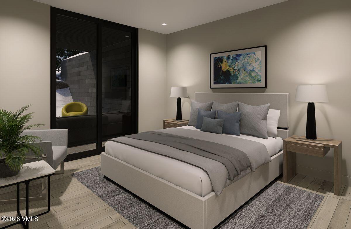 296 Rockledge Road Vail, CO 81657 - Photo 43 of 63 a bedroom with a bed and a painting on the wall