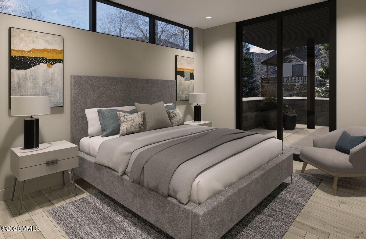 296 Rockledge Road Vail, CO 81657 - Photo 47 of 63 a bedroom with a bed and a lamp