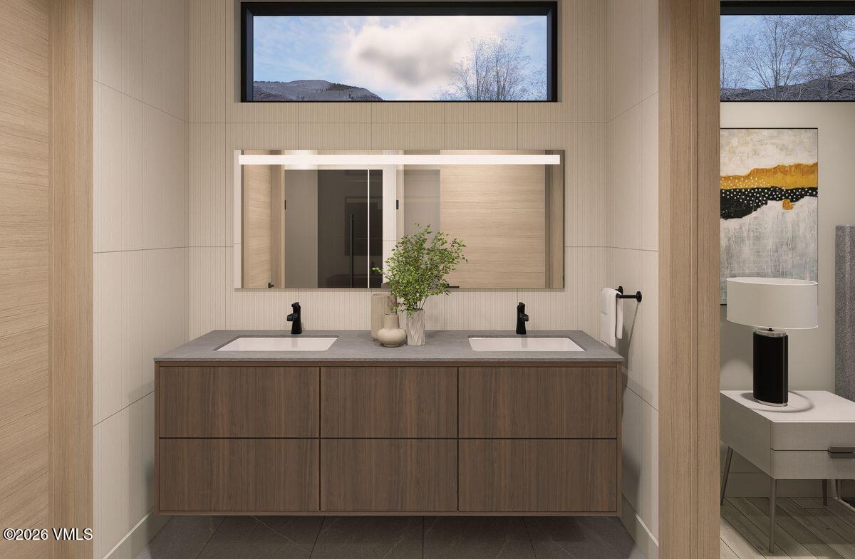 296 Rockledge Road Vail, CO 81657 - Photo 50 of 63 a bathroom with a sink and a mirror