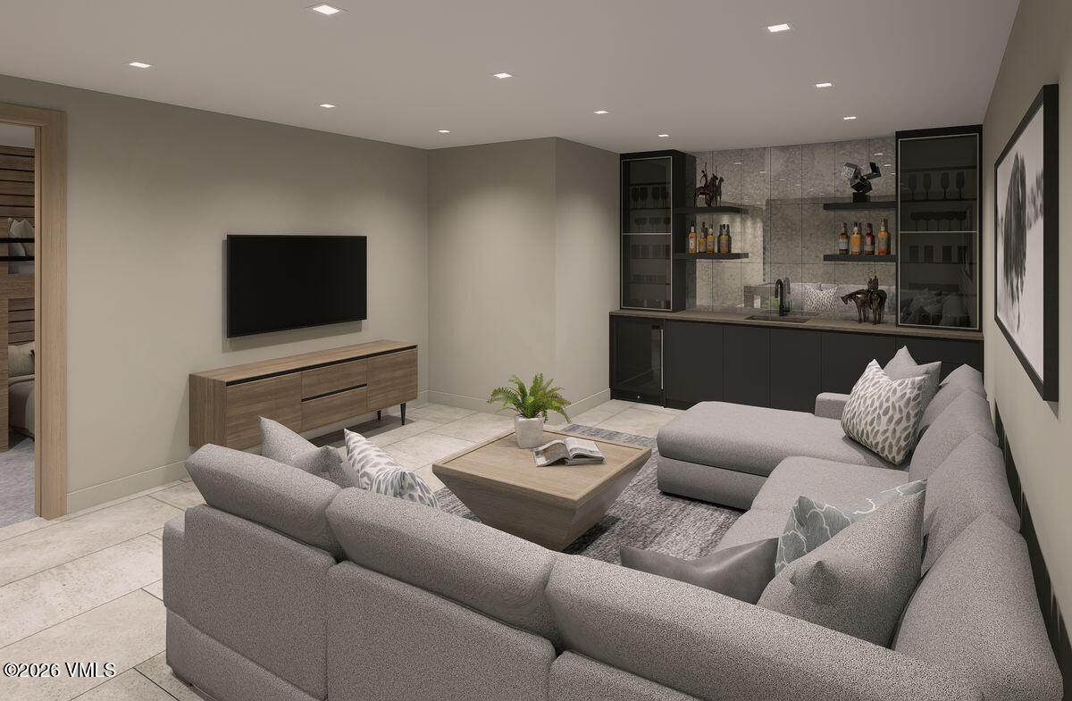 296 Rockledge Road Vail, CO 81657 - Photo 52 of 63 a living room with furniture and a flat screen tv