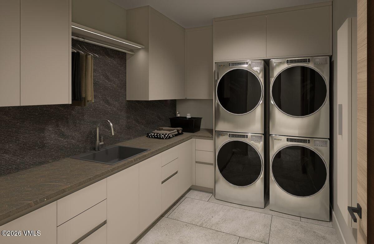 296 Rockledge Road Vail, CO 81657 - Photo 56 of 63 a utility room with sink dryer and washer