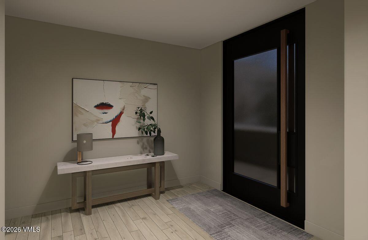 296 Rockledge Road Vail, CO 81657 - Photo 58 of 63 a room with a mirror and a wooden floor
