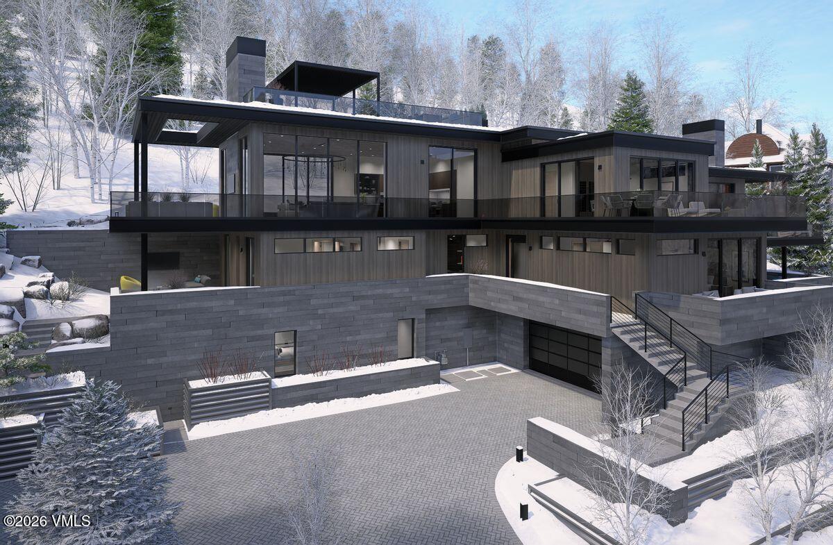 296 Rockledge Road Vail, CO 81657 - Photo 6 of 63 a front view of a house with a yard
