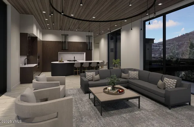 a living room with furniture a fireplace and a floor to ceiling window