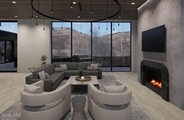 a living room with furniture and a fireplace