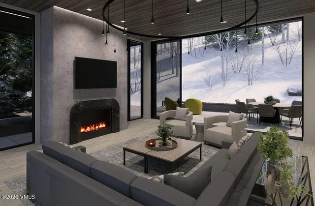 a living room with furniture and a floor to ceiling window