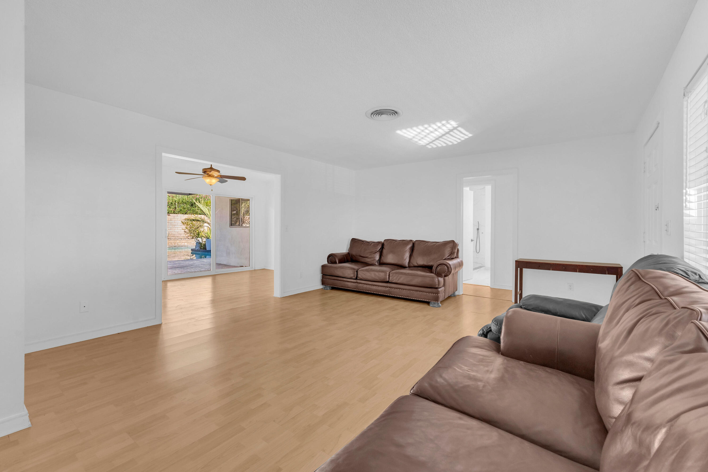 66180 14th Street Desert Hot Springs, CA 92240 - Photo 11 of 42 a living room with furniture and a couch