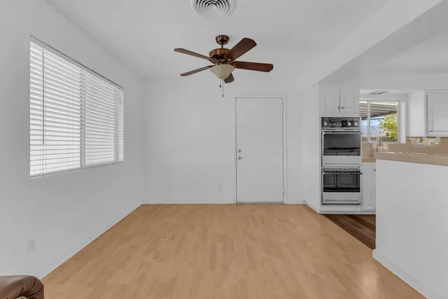 a kitchen with granite countertop a stove and a sink
