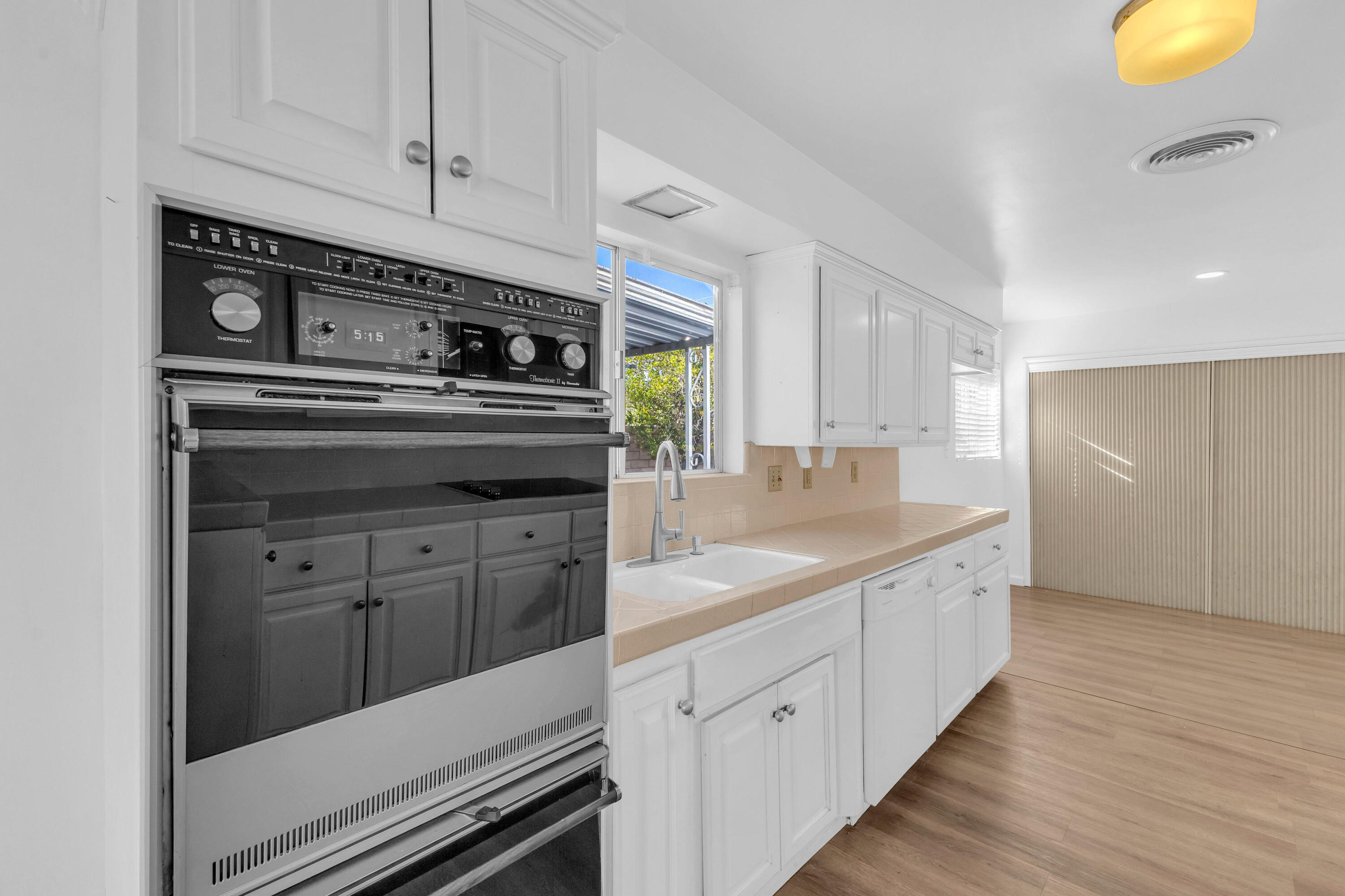 66180 14th Street Desert Hot Springs, CA 92240 - Photo 14 of 42 a kitchen with stainless steel appliances granite countertop a stove and a sink