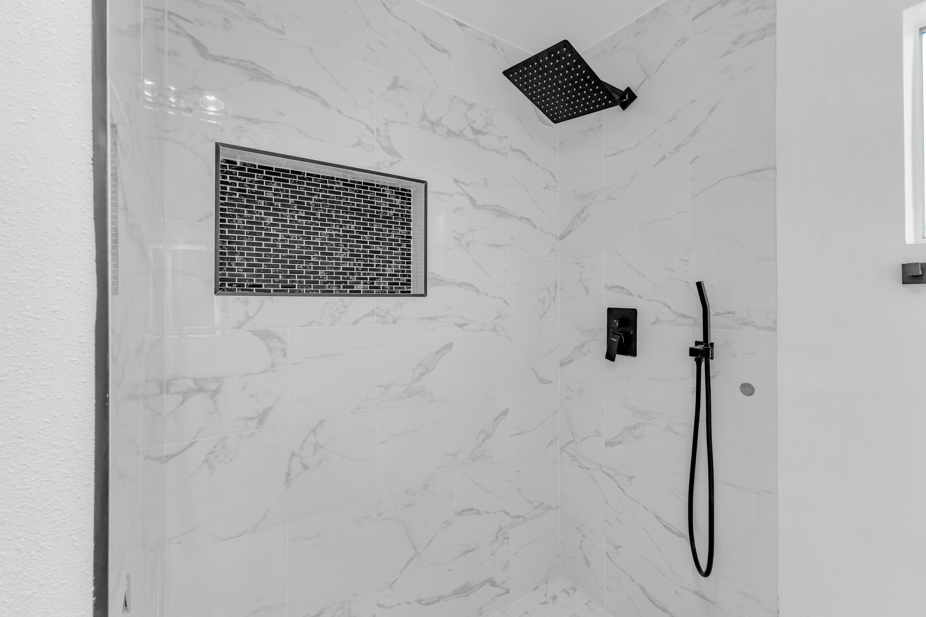 66180 14th Street Desert Hot Springs, CA 92240 - Photo 29 of 42 close up of a shower