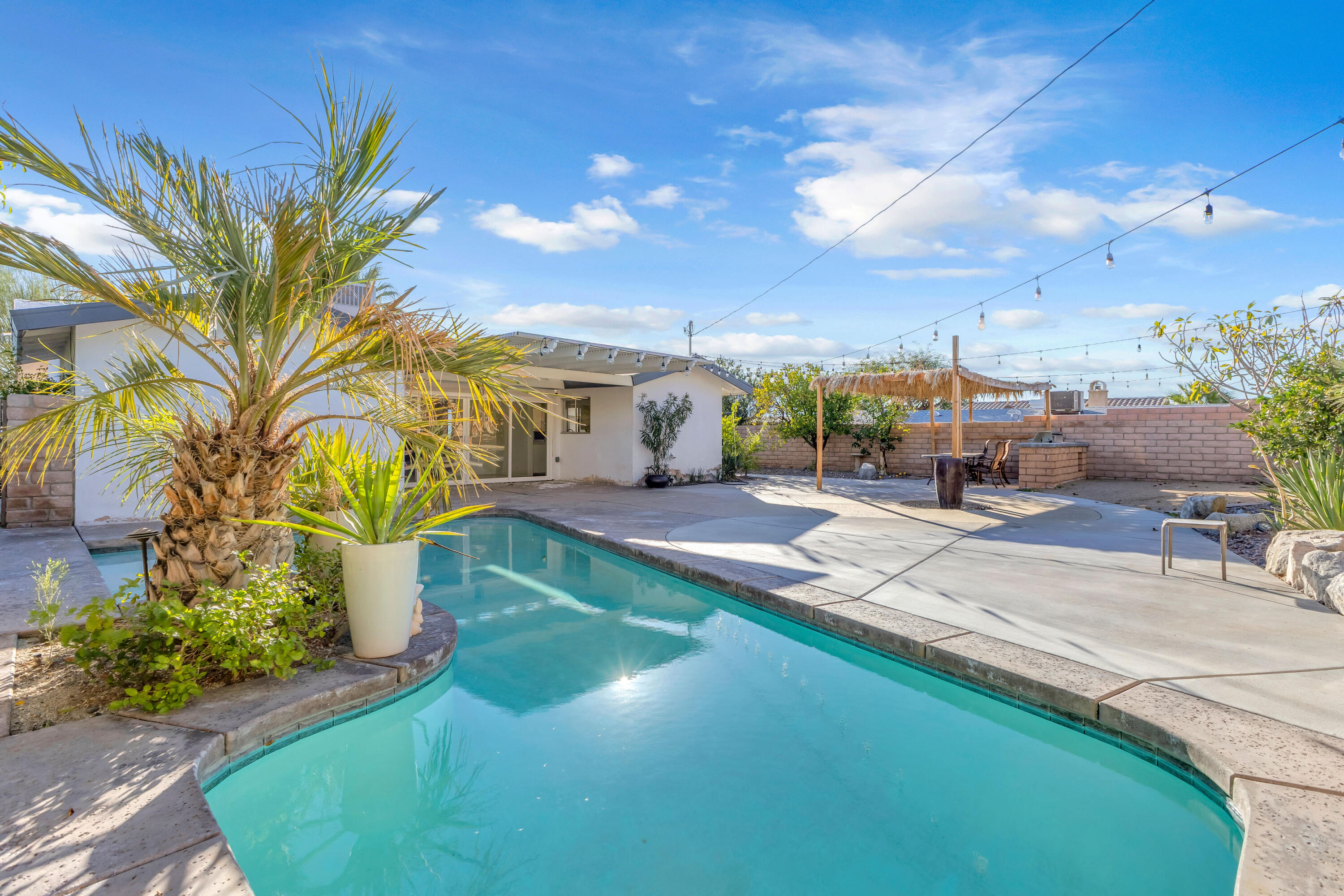 66180 14th Street Desert Hot Springs, CA 92240 - Photo 34 of 42 a swimming pool with yard