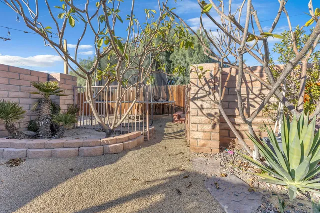 an aerial view of residential houses with outdoor space and street view