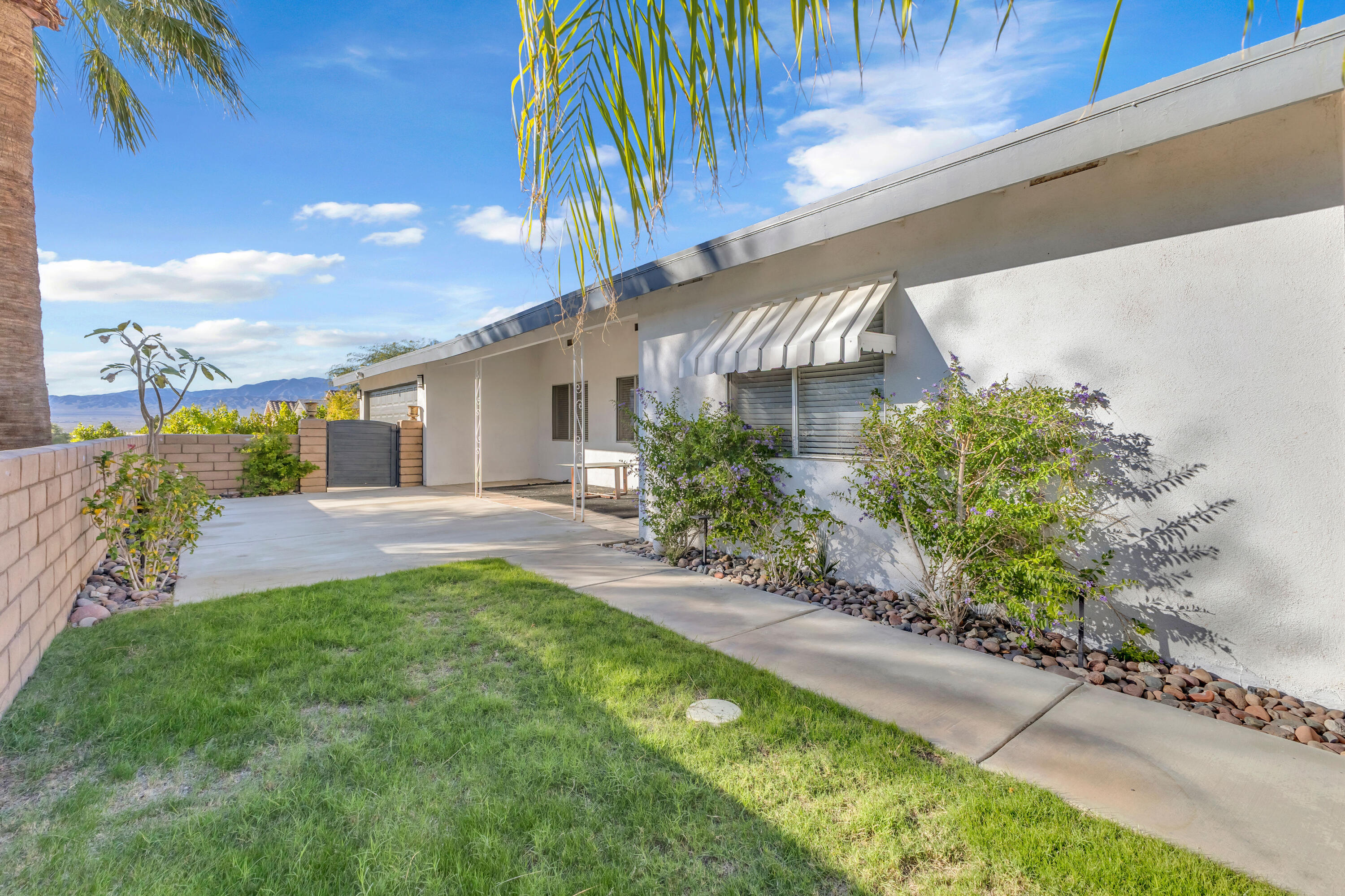 66180 14th Street Desert Hot Springs, CA 92240 - Photo 5 of 42 a view of a back yard of the house