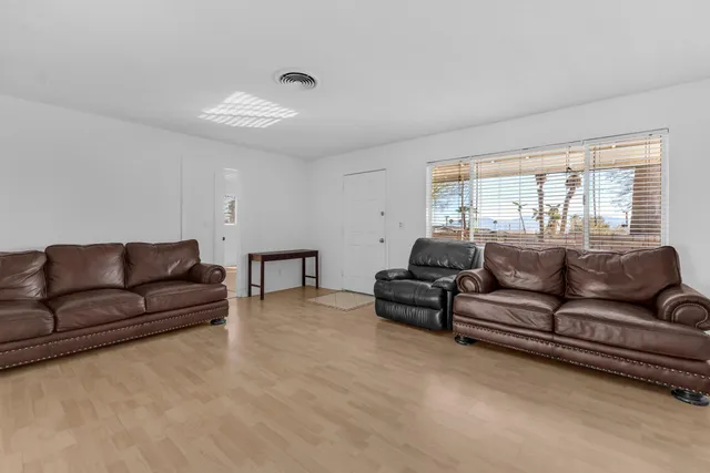 a living room with furniture and a couch