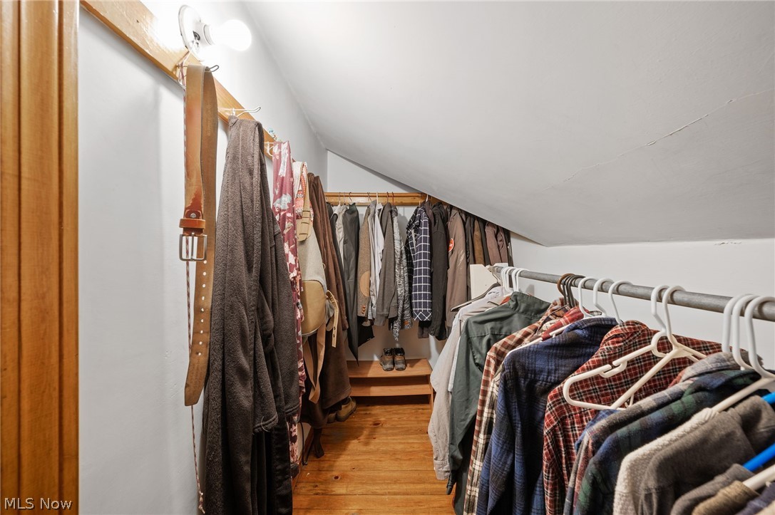 2420 Copley Road Akron, OH 44321 - Photo 31 of 44 Spacious closet with hardwood / wood-style floors and lofted ceiling