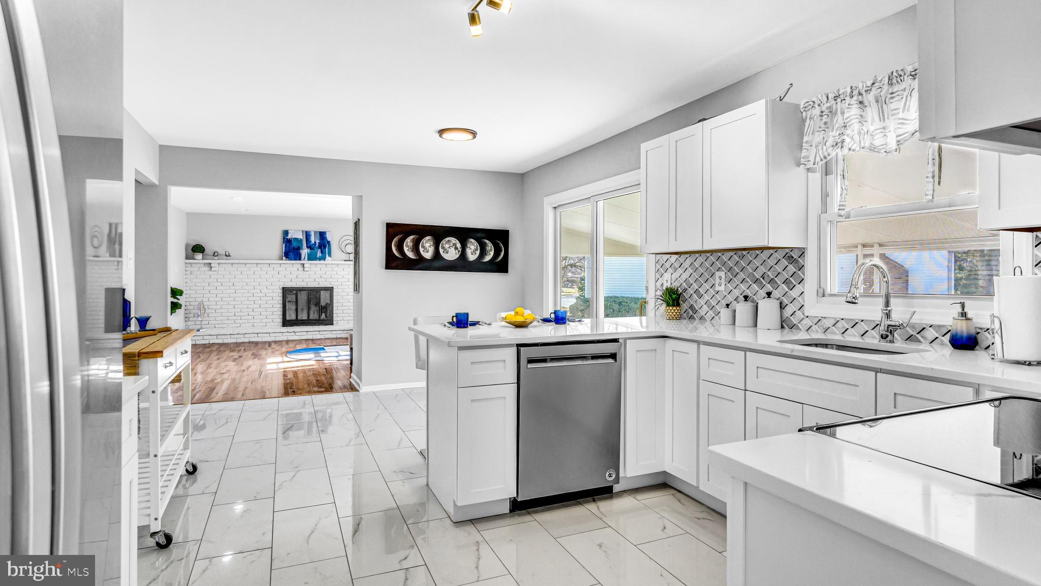 514 Arthur Drive Cherry Hill, NJ 08003 - Photo 11 of 33 a kitchen with a sink cabinets and window