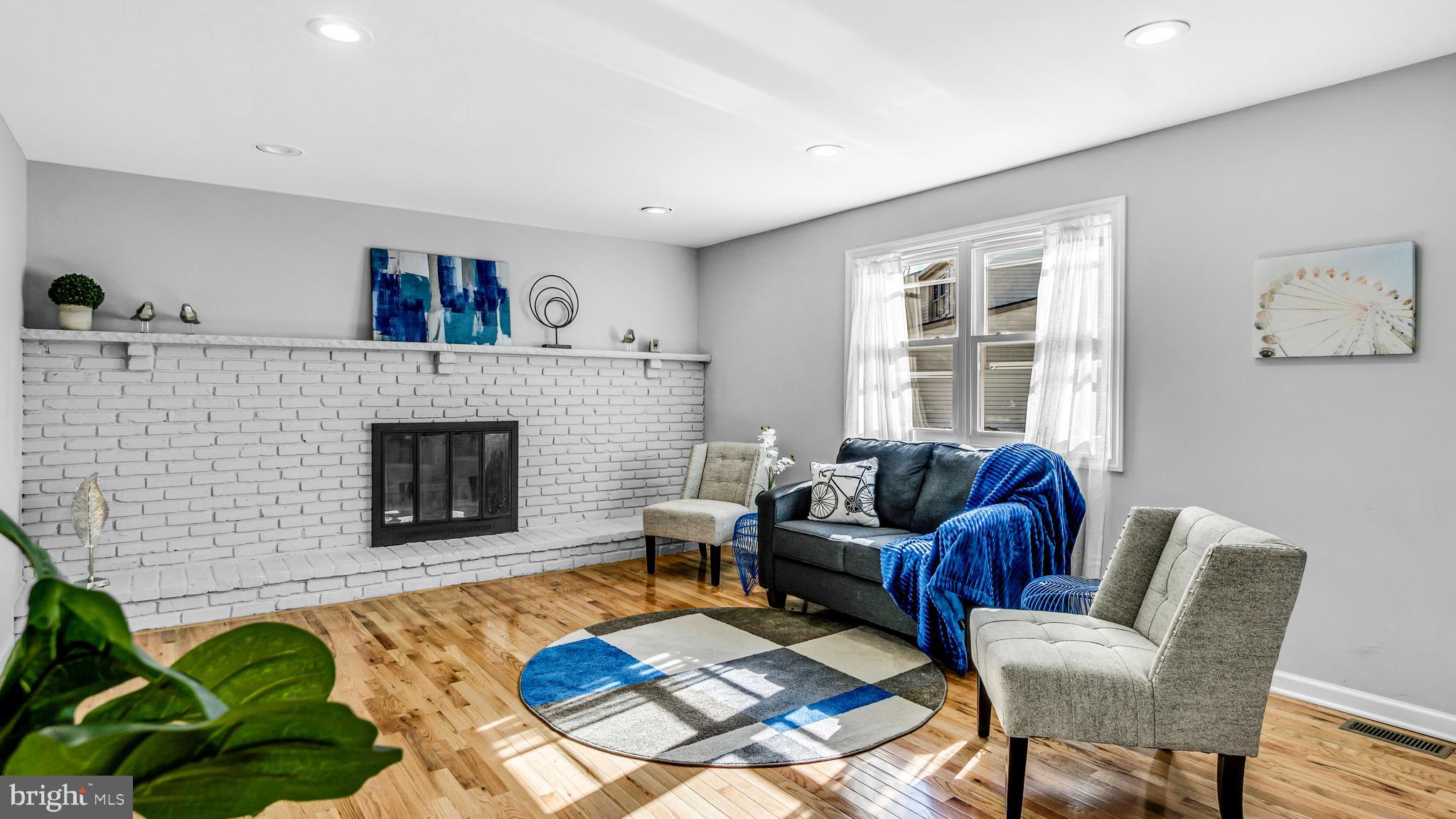 514 Arthur Drive Cherry Hill, NJ 08003 - Photo 15 of 33 a living room with furniture and a fireplace