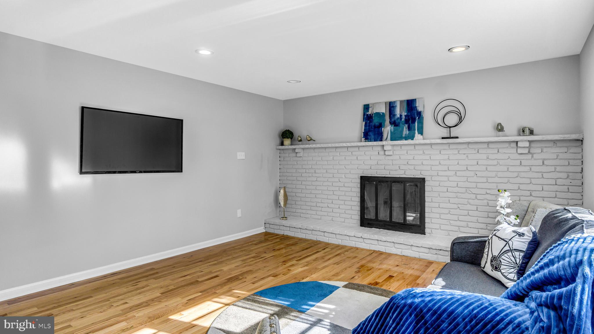 514 Arthur Drive Cherry Hill, NJ 08003 - Photo 16 of 33 a living room with furniture and a fireplace