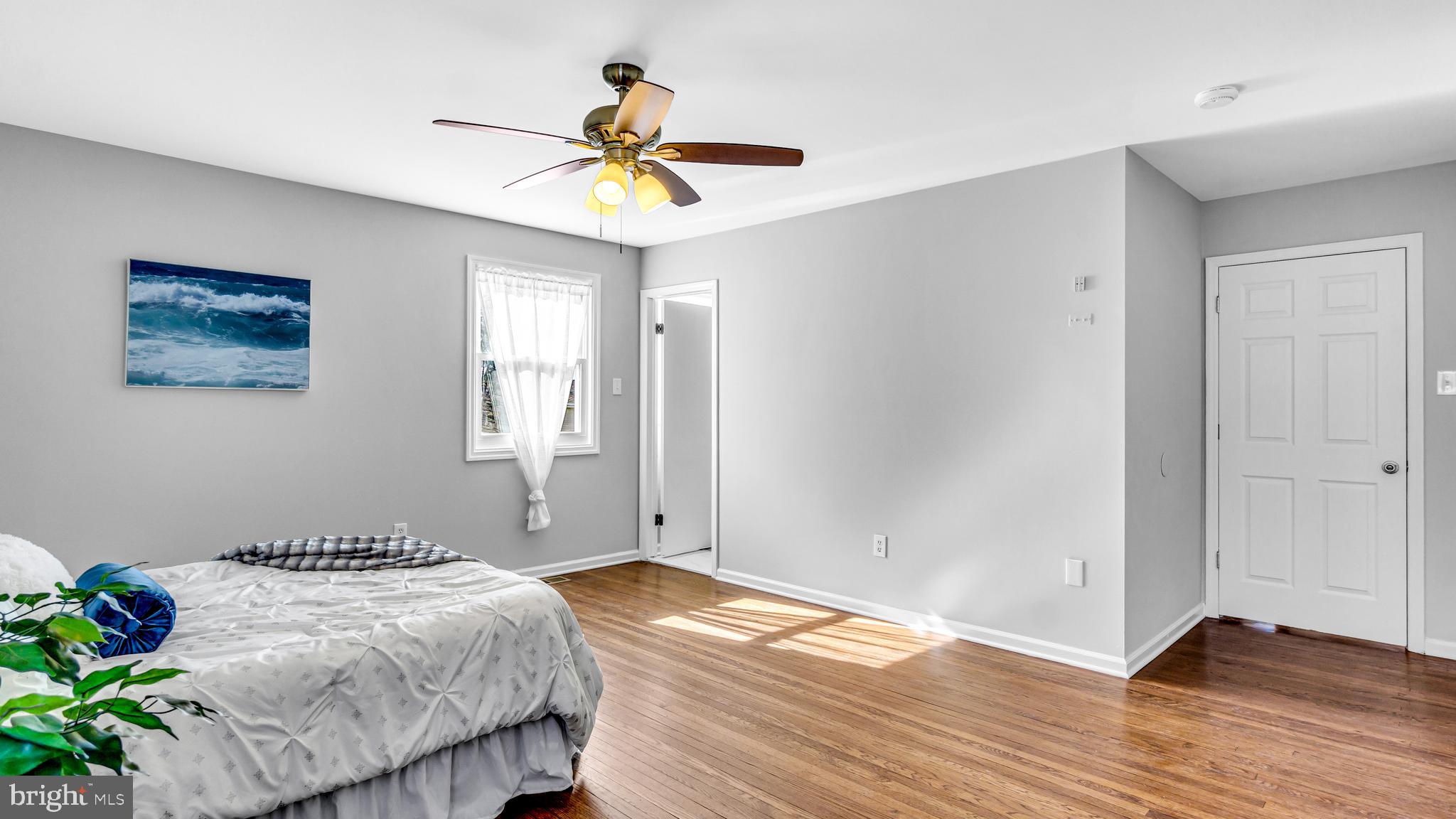 514 Arthur Drive Cherry Hill, NJ 08003 - Photo 26 of 33 a bedroom with a bed and a chandelier