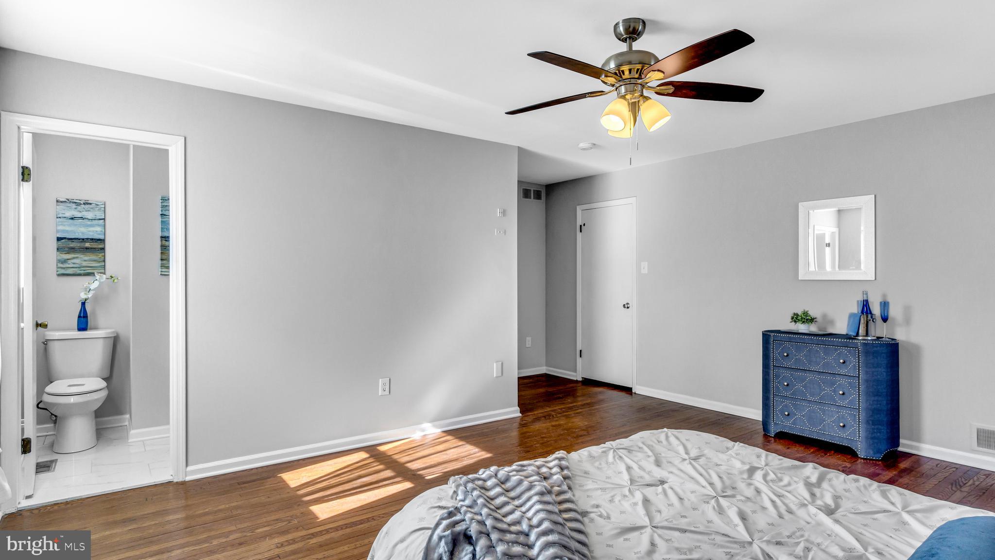 514 Arthur Drive Cherry Hill, NJ 08003 - Photo 27 of 33 a bedroom with a bed and a chandelier