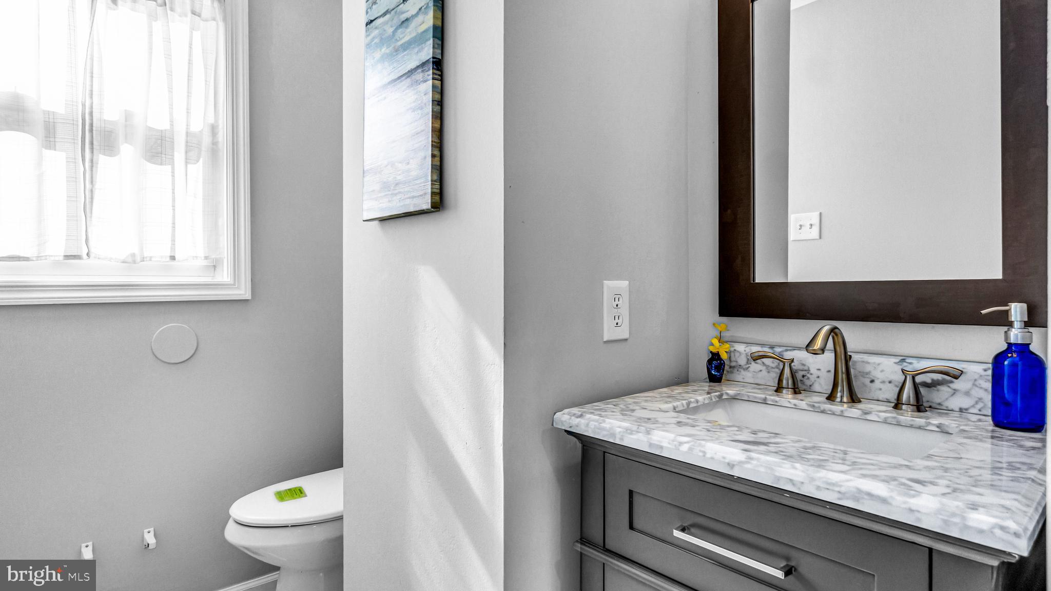 514 Arthur Drive Cherry Hill, NJ 08003 - Photo 29 of 33 a bathroom with a granite countertop sink toilet and a mirror