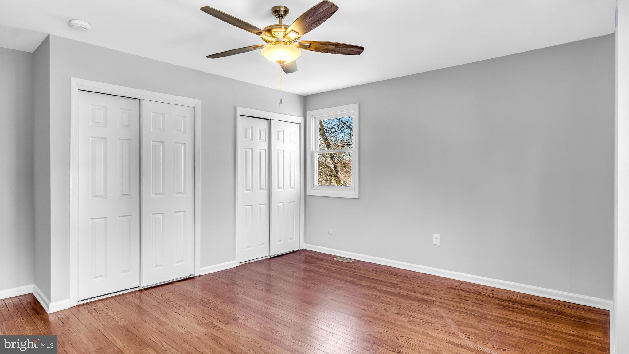 514 Arthur Drive Cherry Hill, NJ 08003 - Photo 31 of 33 a view of an empty room with window and wooden floor