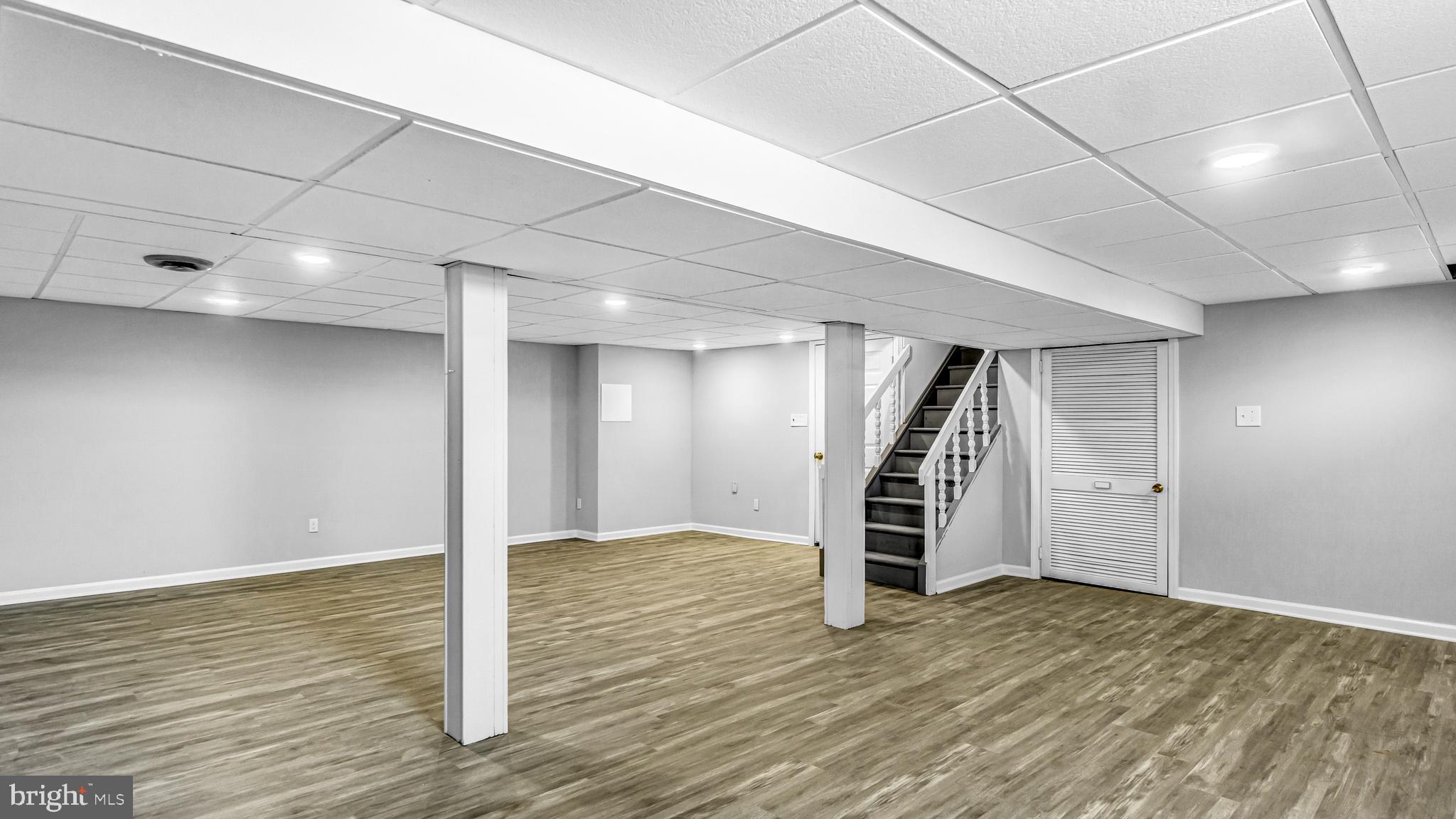 514 Arthur Drive Cherry Hill, NJ 08003 - Photo 32 of 33 a view of an empty room with wooden floor entryway and stairs
