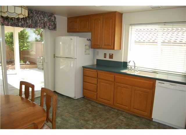 925 Alyssum Road Carlsbad, CA 92011 - Photo 3 of 10 Large Country Kitchen with access to back yard.