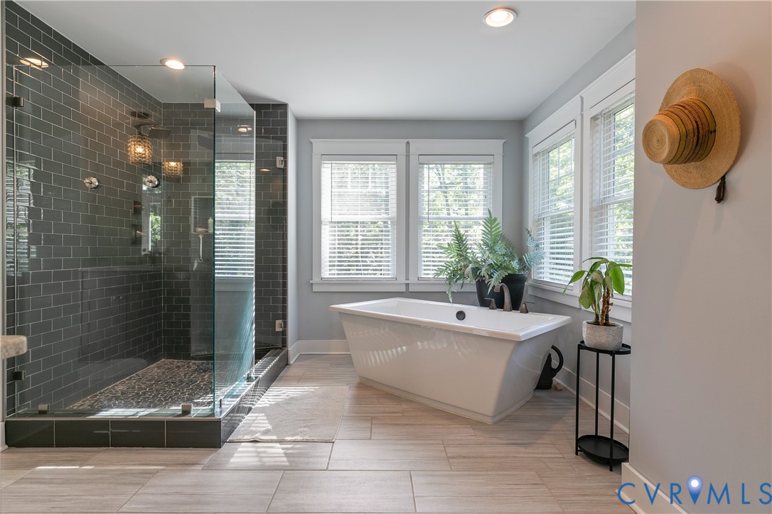 9749 Hoke Brady Road Henrico, VA 23231 - Photo 31 of 53 a spacious bathroom with a tub shower and window