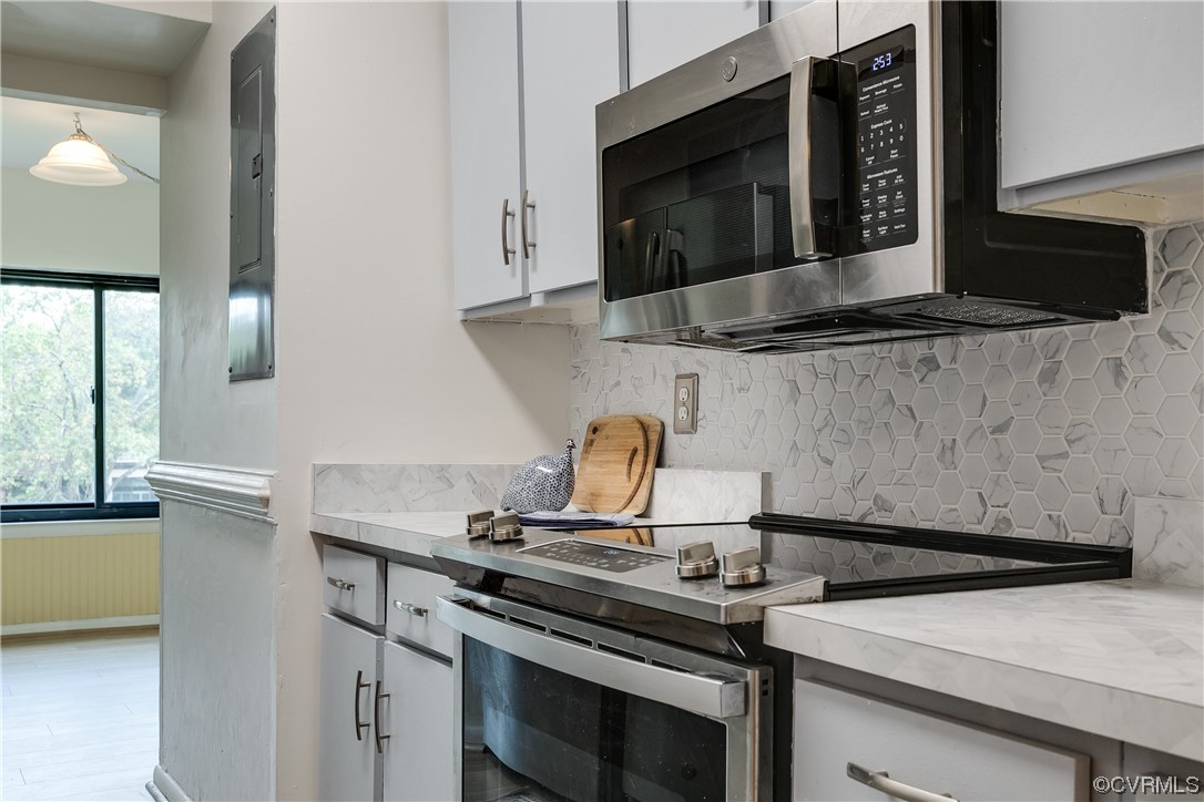 1509 Regency Woods Road, Unit 103 Henrico, VA 23238 - Photo 15 of 31 a stove top oven sitting inside of a kitchen