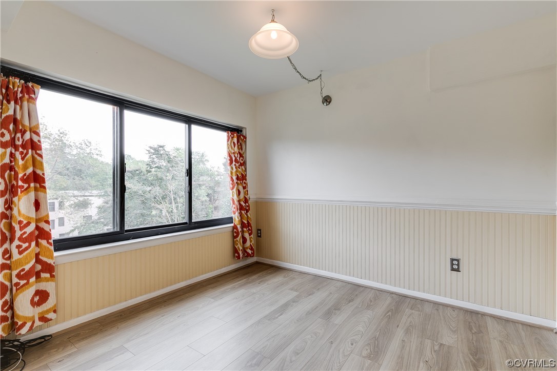 1509 Regency Woods Road, Unit 103 Henrico, VA 23238 - Photo 17 of 31 a view of empty room with wooden floor and fan