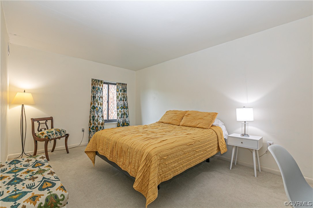 1509 Regency Woods Road, Unit 103 Henrico, VA 23238 - Photo 18 of 31 a bedroom with a bed chair and a window