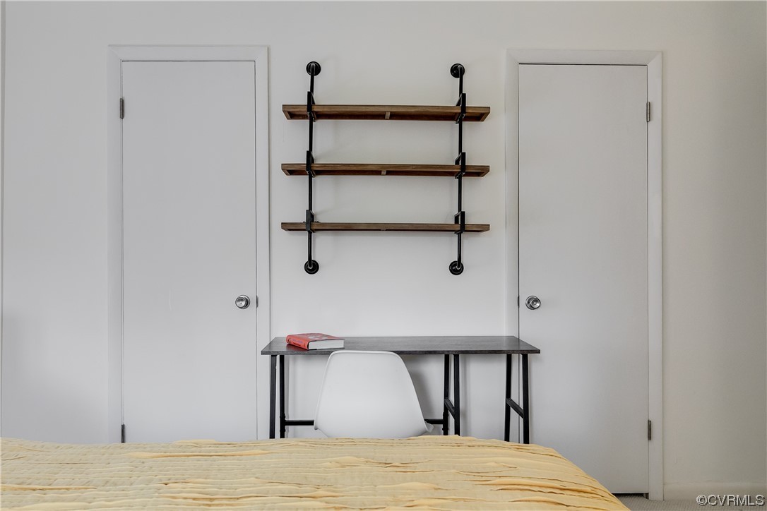 1509 Regency Woods Road, Unit 103 Henrico, VA 23238 - Photo 20 of 31 a bedroom with a bed and a table