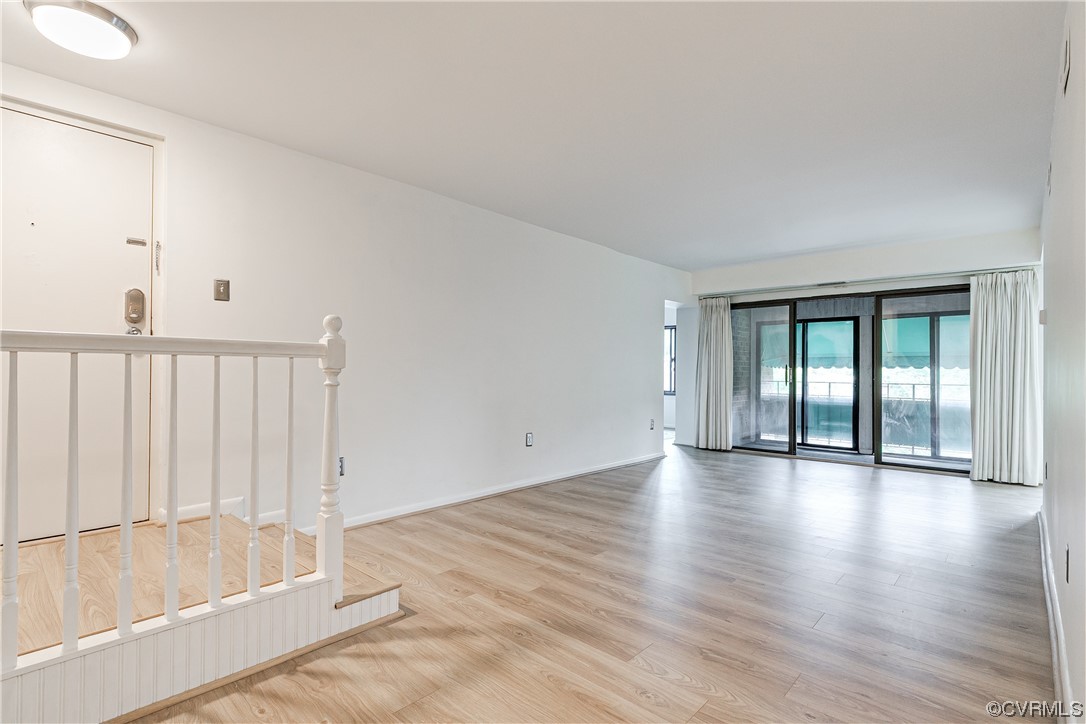 1509 Regency Woods Road, Unit 103 Henrico, VA 23238 - Photo 2 of 31 a view of an empty room with wooden floor and entryway